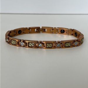 Copper Tone Metal Bracelet with Carbon Fiber and Stone Accent